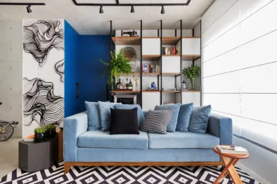 Projeto adapta apartamento para estilo de vida sem excessos com atmosfera industrial