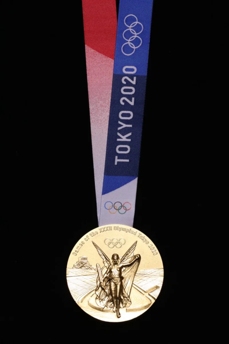 This undated handout photograph released on July 24, 2019 by Tokyo 2020 shows the front side of gold medal for the Tokyo 2020 Olympic Games in Tokyo. (Photo by Handout / Tokyo 2020 / AFP) / - NO Internet - NO RESALE / -----EDITORS NOTE --- RESTRICTED TO EDITORIAL USE - MANDATORY CREDIT "AFP PHOTO / Tokyo 2020" - NO MARKETING - NO ADVERTISING CAMPAIGNS - DISTRIBUTED AS A SERVICE TO CLIENTS - NO ARCHIVES