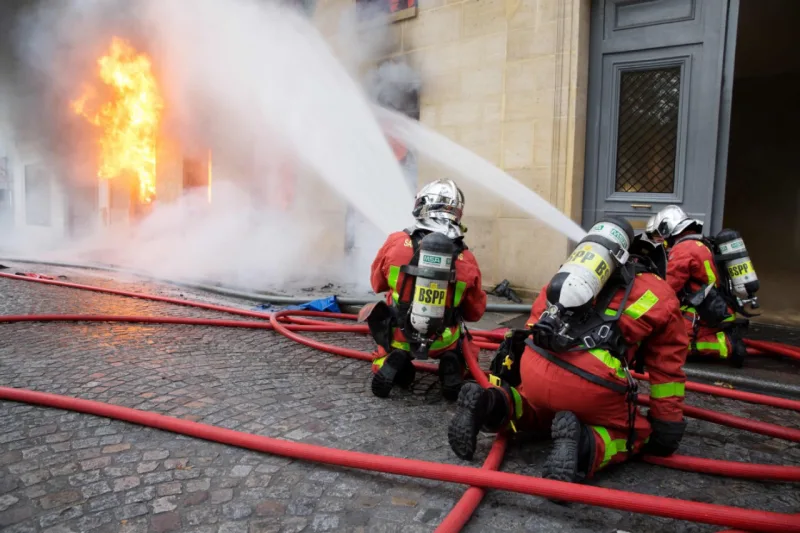 Firefighters work to put out a fire in "La Hune" book shop in Paris on November 16, 2017.
Seven people were lightly injured in the fire, and some 50 firefighters and a dozen vehicles were deployed. / AFP PHOTO / Karim DAHER