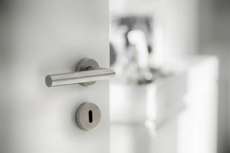 Door latch at the bathroom