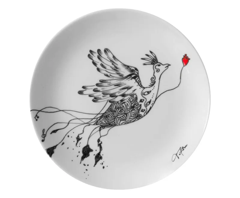 Prato decorativo Fênix, em porcelana. Na Westwing, R$ 144,90.