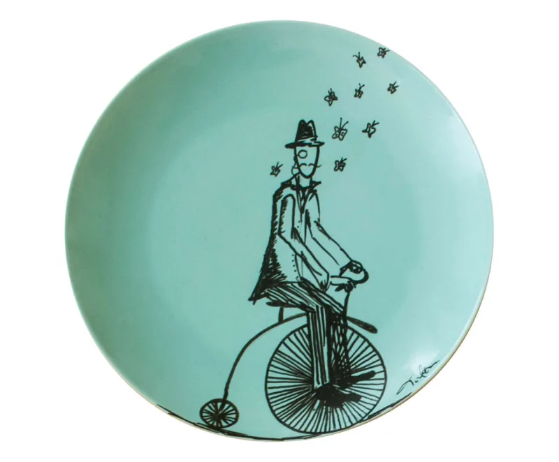Prato decorativo Homem Borboletas. Na Westwing, R$ 132,90.