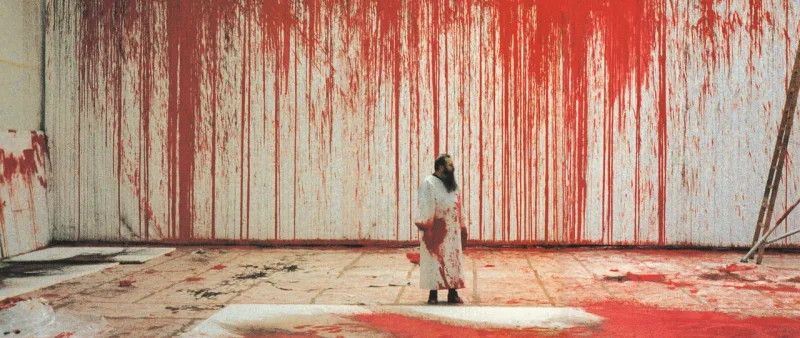 Hermann Nitsch em sua performance da pintura de número 20 em 1987