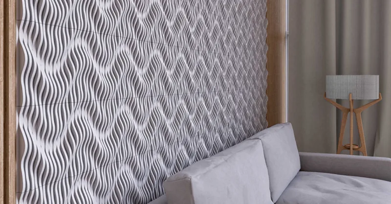 Parede revestida com a Fiji Waves, revestimento em mosaico de mármores que é um dos mais vendidos da Mosarte. Assim como as linhas Versalhes, Niterói Legno, Pétlas e Clarity, foi lançada em nova releitura na coleção Constelações.