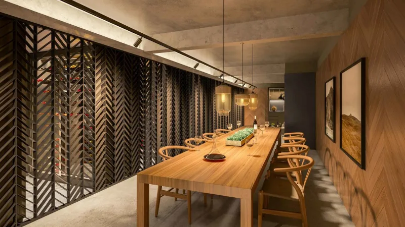 O espaço com área de convivência e as caves particulares, decorado por Jayme Bernardo. Foto: Divulgação.